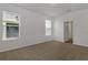 Bright bedroom with neutral carpeting and ample natural light from two windows at 16242 Outlook Shore Aly, Winter Garden, FL 34787