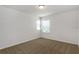 Cozy bedroom featuring neutral carpet and two windows, with a ceiling light at 16242 Outlook Shore Aly, Winter Garden, FL 34787
