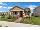 Charming single-Gathering home with a welcoming front porch and manicured landscaping at 16242 Outlook Shore Aly, Winter Garden, FL 34787