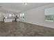 Bright and open living space with modern fixtures and an adjacent kitchen at 16242 Outlook Shore Aly, Winter Garden, FL 34787