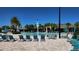 Inviting poolside area with ample seating, umbrellas, and well-maintained brick pavers at 16242 Outlook Shore Aly, Winter Garden, FL 34787