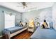 Themed bedroom features two twin beds, and an ice themed mural at 165 Scrub Jay Way, Davenport, FL 33896