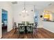 Dining area offers seating for six, wood floors, and bright, natural light at 165 Scrub Jay Way, Davenport, FL 33896