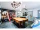Spacious game room with Star Wars themed decor, pool table, and foosball for Gathering fun at 165 Scrub Jay Way, Davenport, FL 33896