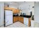 Efficient kitchen featuring modern appliances, granite countertops, and breakfast bar at 165 Scrub Jay Way, Davenport, FL 33896