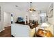 Bright living room offers wood floors and comfortable furniture for relaxing at 165 Scrub Jay Way, Davenport, FL 33896