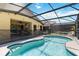 Sparkling pool with screened-in lanai, perfect for outdoor relaxation and entertainment at 165 Scrub Jay Way, Davenport, FL 33896