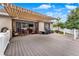 Large back deck featuring a retractable awning, dining area, stainless steel grill, with room for entertaining at 1692 Blue Grass Blvd, Deland, FL 32724
