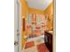 Bright bathroom featuring colorful decor, a vanity, and a shower with tub combination at 1692 Blue Grass Blvd, Deland, FL 32724
