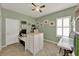 Versatile bedroom offering room for a desk, featuring a ceiling fan and plenty of natural light at 1692 Blue Grass Blvd, Deland, FL 32724