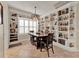 Cozy dining room with custom built-in shelving for display, and stylish chandelier at 1692 Blue Grass Blvd, Deland, FL 32724