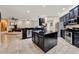 Modern kitchen with stainless steel appliances, granite countertops, and a large center island at 1692 Blue Grass Blvd, Deland, FL 32724