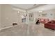 Spacious living room features tile flooring, columns and neutral paint, creating a bright and inviting space at 1692 Blue Grass Blvd, Deland, FL 32724