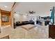 Open living area with neutral walls, tile floors, and seamless flow to kitchen at 1692 Blue Grass Blvd, Deland, FL 32724