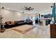 Open living area with neutral walls, tile floors, and seamless flow to kitchen at 1692 Blue Grass Blvd, Deland, FL 32724