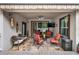Covered patio with ceiling fan and lounge seating overlooking the backyard at 1692 Blue Grass Blvd, Deland, FL 32724