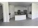 Open kitchen with stainless steel appliances, ample counter space, and modern finishes for stylish cooking at 1889 Blissful Dr, Kissimmee, FL 34744