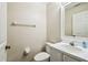 Powder room featuring a toilet, vanity with sink, framed mirror, and neutral paint at 1936 Westpointe Cir, Orlando, FL 32835