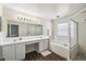 Bathroom featuring double sinks, garden tub, and glass enclosed shower at 1936 Westpointe Cir, Orlando, FL 32835