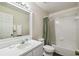 Bright bathroom with a shower and tub combo and white vanity at 1936 Westpointe Cir, Orlando, FL 32835