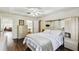 Bedroom showcasing natural light, dresser, and hardwood style flooring at 1936 Westpointe Cir, Orlando, FL 32835