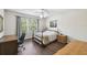 This bright bedroom features a ceiling fan, and a window with lush views at 1936 Westpointe Cir, Orlando, FL 32835