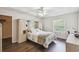 Comfortable bedroom featuring wood-look flooring, natural light, and ceiling fan at 1936 Westpointe Cir, Orlando, FL 32835