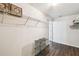 Walk-in closet with wire shelving, dark wood-look floors, and neutral paint at 1936 Westpointe Cir, Orlando, FL 32835