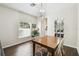 Cozy dining area featuring hardwood floors, a modern light fixture, and stylish decor at 1936 Westpointe Cir, Orlando, FL 32835