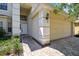 Inviting front exterior featuring a two-car garage, walkway, and manicured greenery at 1936 Westpointe Cir, Orlando, FL 32835