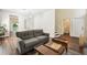 Cozy living room with hardwood floors, neutral furniture, and a bright, open space at 1936 Westpointe Cir, Orlando, FL 32835
