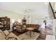 Open-concept living room with kitchen access, cozy seating, and bright natural lighting at 1936 Westpointe Cir, Orlando, FL 32835