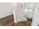 Well-lit staircase with a window at the front door at 1936 Westpointe Cir, Orlando, FL 32835