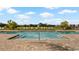 Modern community pool with sun shelves, comfortable lounge chairs, and manicured landscaping for a relaxing experience at 2273 White Buffalo St, Apopka, FL 32703