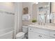 Well-lit bathroom with a shower-tub combo and a marble countertop vanity at 2348 Daisy Tree Rd, St Cloud, FL 34771
