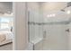 Stylish shower with a glass enclosure, tiled walls, a built-in bench, and modern fixtures at 2348 Daisy Tree Rd, St Cloud, FL 34771