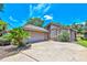Charming home with well-maintained landscaping, a two-car garage and large driveway at 247 W Sabal Palm Pl, Longwood, FL 32779