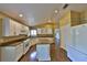 Bright kitchen features an island, granite countertops, stainless steel appliances, and wood floors at 247 W Sabal Palm Pl, Longwood, FL 32779