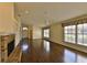Spacious living room featuring wood floors, a fireplace, large windows, and lots of natural light at 247 W Sabal Palm Pl, Longwood, FL 32779