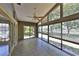 Bright sun room with wall to wall windows provides an open view of the outdoor greenery at 247 W Sabal Palm Pl, Longwood, FL 32779