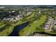Overhead view of a community with a winding waterway surrounded by lush greenery and manicured lawns at 2638 Clarinet Dr, Orlando, FL 32837