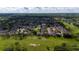Aerial view showcases a neighborhood with mature landscaping and golf course access, blending suburban living with recreation at 2638 Clarinet Dr, Orlando, FL 32837