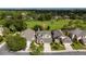 An aerial view showcasing a beautiful home in a lush, green neighborhood at 2638 Clarinet Dr, Orlando, FL 32837