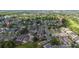 Expansive community aerial view shows the neighborhood layout with mature trees and manicured lawns at 2638 Clarinet Dr, Orlando, FL 32837