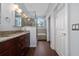 Stylish bathroom with a granite vanity, walk-in shower, and wood-look tile flooring at 2638 Clarinet Dr, Orlando, FL 32837