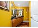Vibrant bathroom features yellow walls and a granite-topped vanity at 2638 Clarinet Dr, Orlando, FL 32837