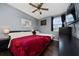 Spacious bedroom with hardwood floors, a ceiling fan, and a large window with natural light at 2638 Clarinet Dr, Orlando, FL 32837