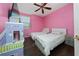 Cheerful bedroom with hardwood floors, ceiling fan, closet, and plenty of space at 2638 Clarinet Dr, Orlando, FL 32837
