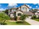 Charming two-story home with a well-maintained lawn and beautiful landscaping, creating great curb appeal at 2638 Clarinet Dr, Orlando, FL 32837