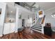 Bright foyer showcasing an open staircase, hardwood floors, and modern decor at 2638 Clarinet Dr, Orlando, FL 32837